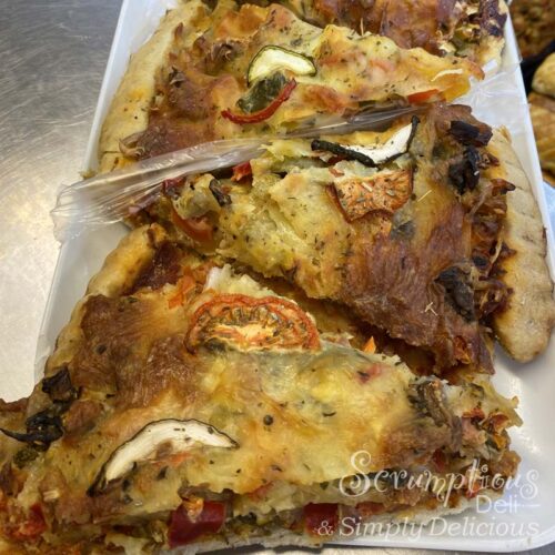Mediterranean vegetable pizza slice